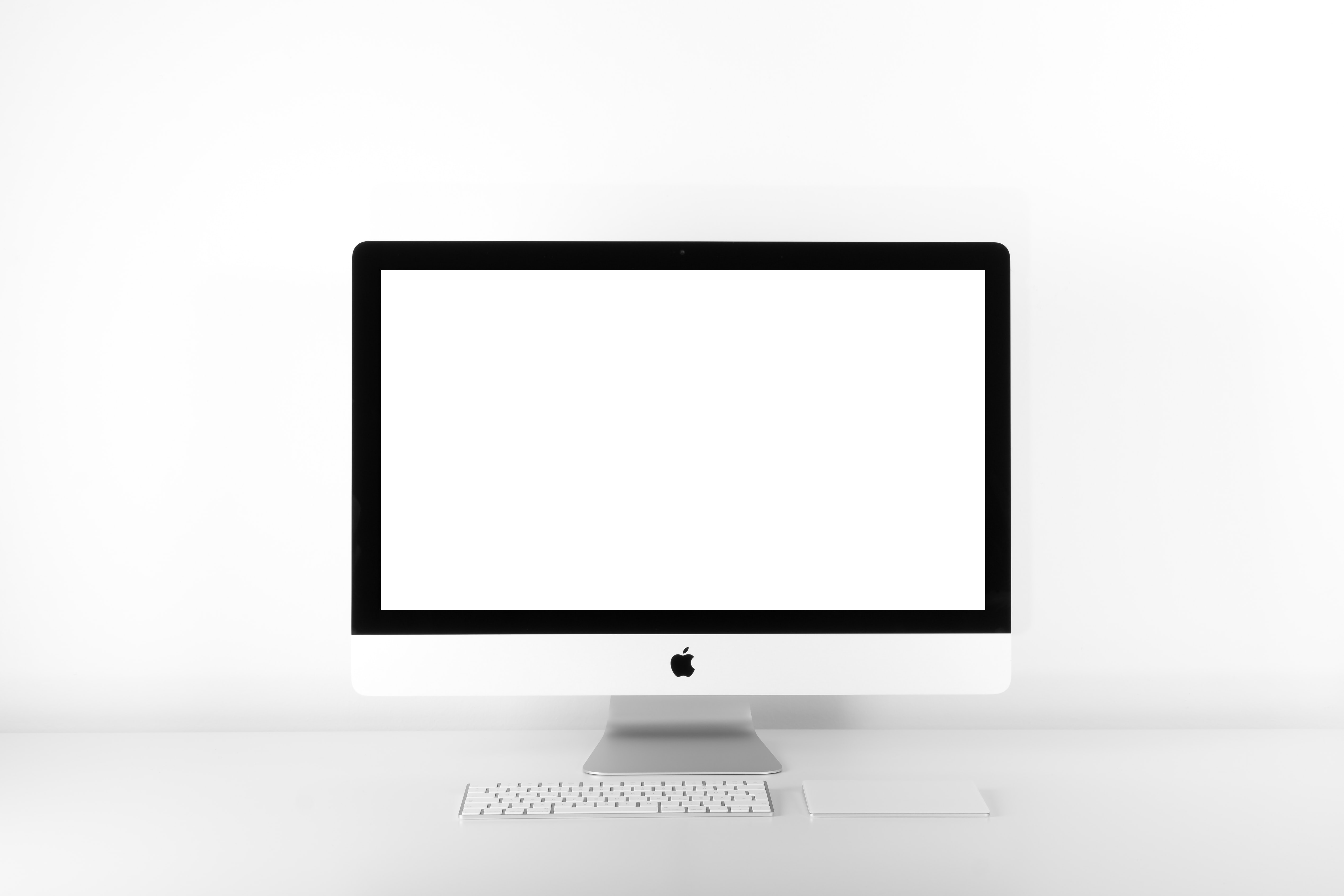 A computer with a blank, white screen